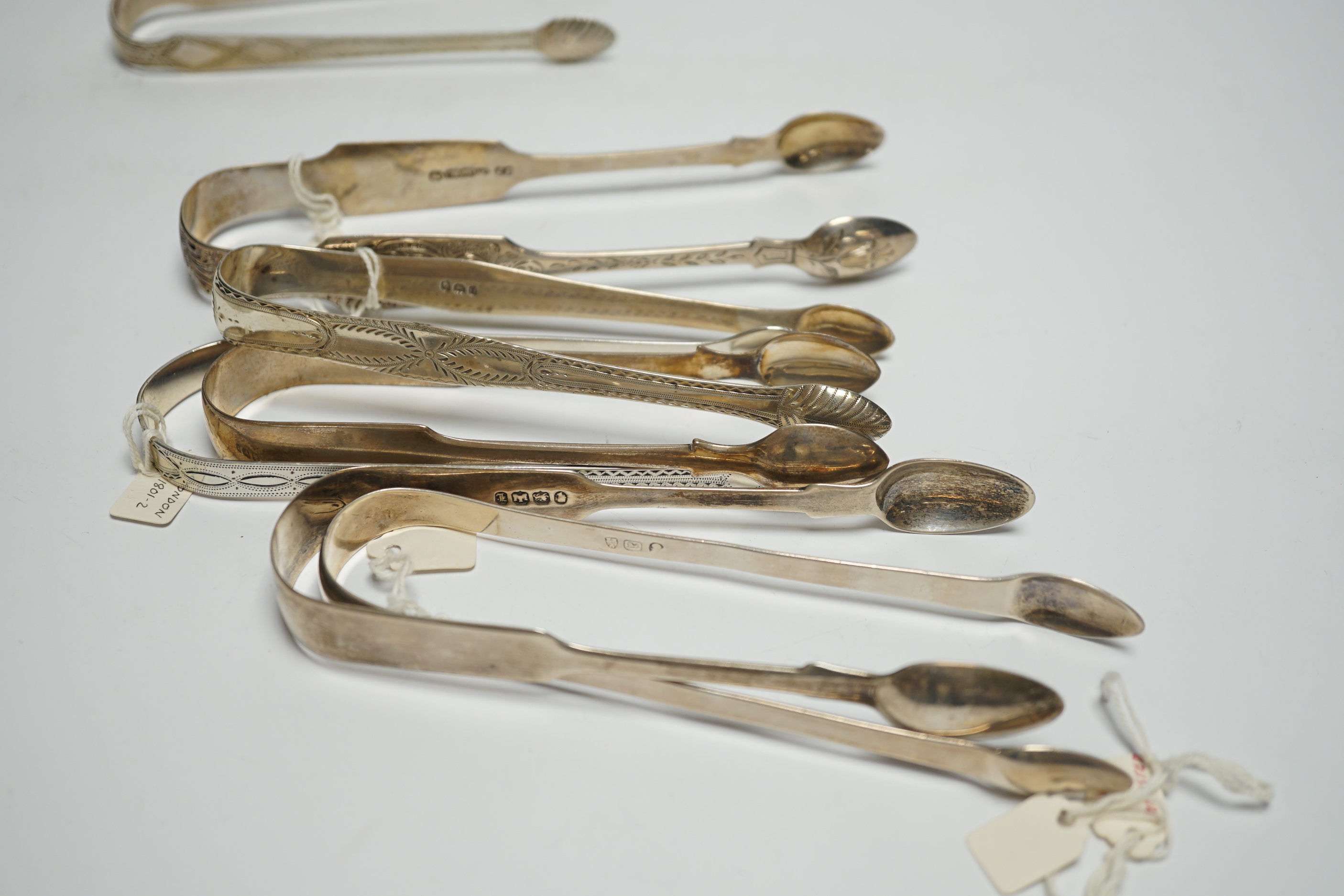 Nine assorted pairs of 19th century silver sugar tongs, including Scottish and Irish, various dates and makers